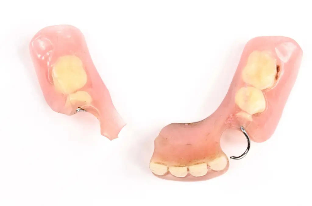 Dental technician repairing a denture at Chrome Cast Dental Laboratory Crowborough